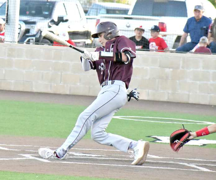 BOMBS AWAY - Littlefield’s, Adam MacDonald, launches a shot that one-hopped to the left field fence, during the top of the third inning of the Wildcats, 19-1, game one victory over Stanton in their Bi-district play-off series in Lamesa this past weekend. (Staff Photo by Derek Lopez)