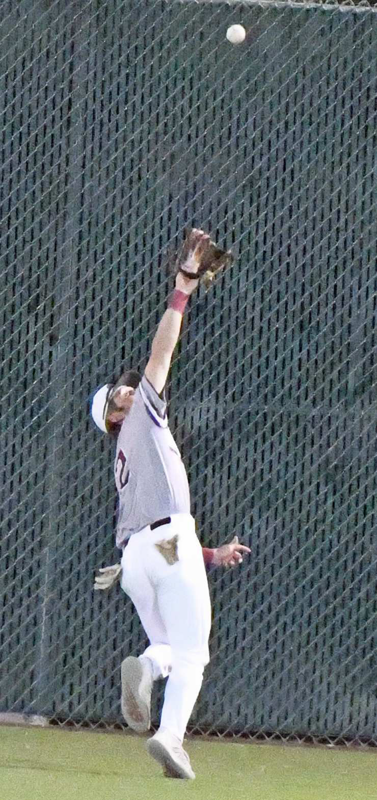 Littlefield senior, Major McNeese, retreats towards the fence in center field and makes a catch for out number two in the top of the third inning of the Wildcats’ victory over Sundown on Monday at Wildcat Field. (Staff Photo by Derek Lopez)