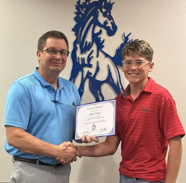 Tullie Struve, School Board President, left, awards Wyatt Francis, right, Olton Mustang Baseball All District - 2nd Team Outfield. (Submitted Photo)