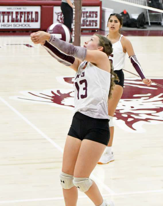 Littlefield’s Maggie McNeese saves a ball on the sideline, during the first set of the Lady Cats’ district match-up with Shallowater on Tuesday at Wildcat Gym. (Staff Photo by Derek Lopez)