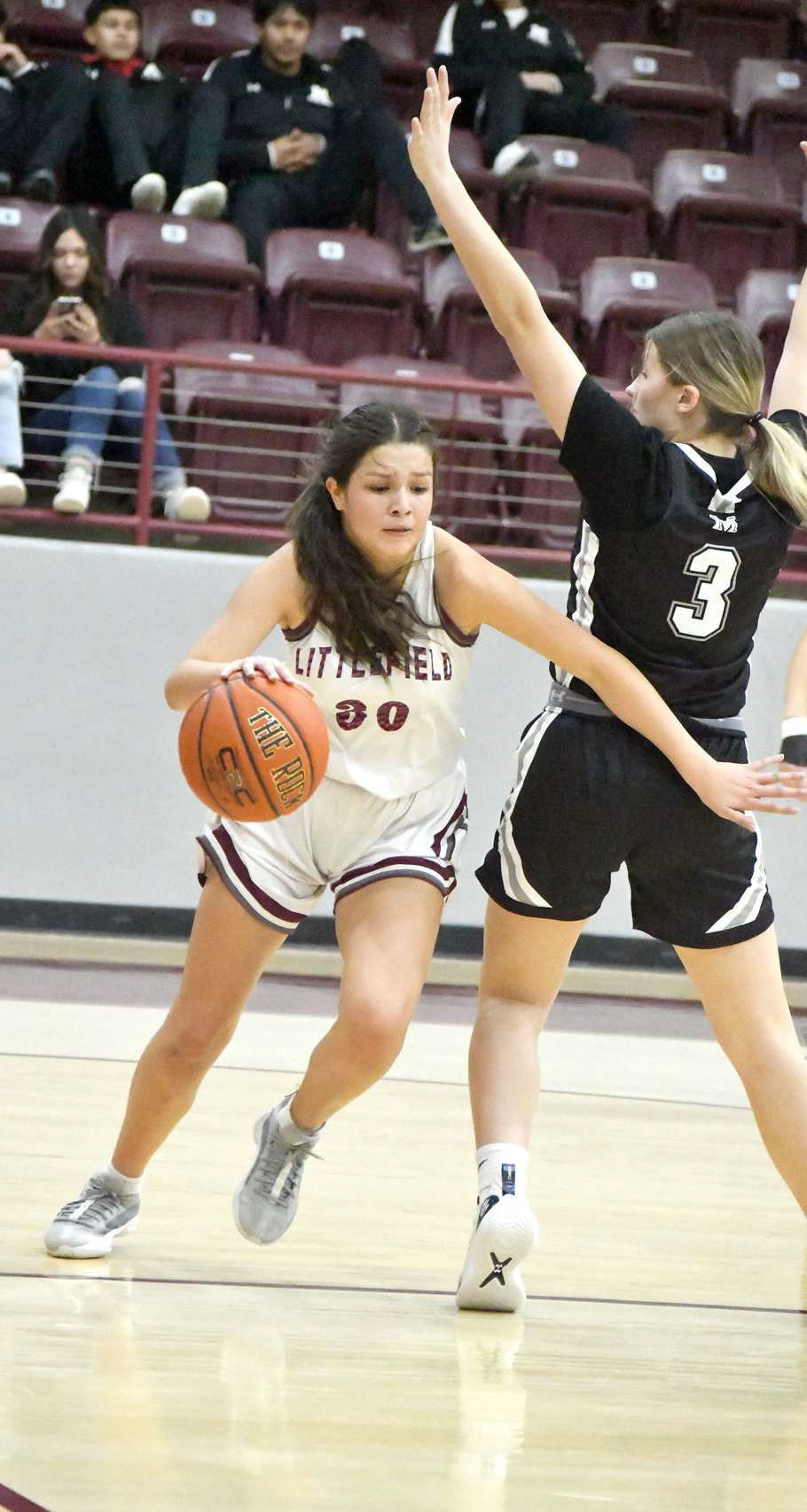 Littlefield junior, Ari Castillo (30), gets around a Muleshoe defender on the baseline, as she gets to the bucket for two of her 21 points in Friday’s district victory over Muleshoe, 64-31. (Staff Photo by Derek Lopez)