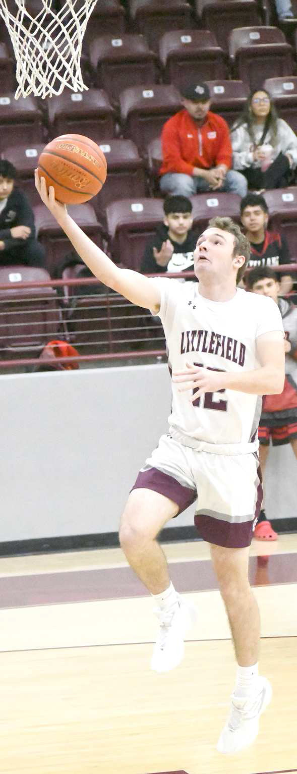 Littlefield junior, Chip Green, gets out on the break and drops in an easy lay-up, during the first half of the Wildcats’, 72-34, victory over the Lobos at Wildcat Gym on Tuesday in non-district play. (Staff Photo by Derekl Lopez)