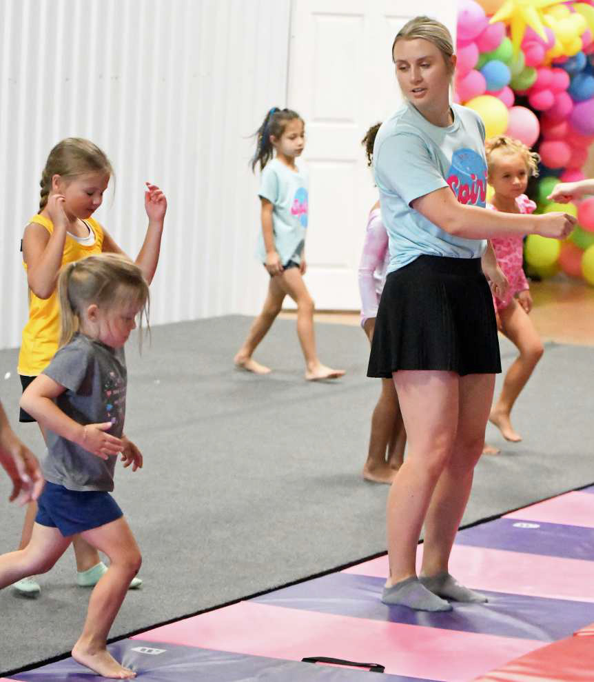 Spirit Tumble and Cheer instructor Brooke Clarkson goes through their performance with her campers prior to their final show on Friday morning. (Staff Photo by Derek Lopez)