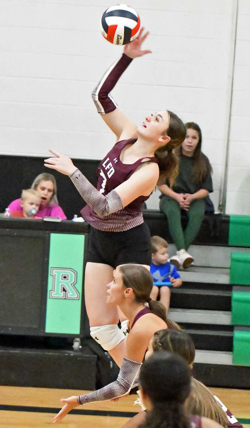 Littlefield’s Lyric Rios delivers a hit, during set one of the Lady Cats victory over Klondike at Ropes on Tuesday during their dual. (Staff Photo by Derek Lopez)