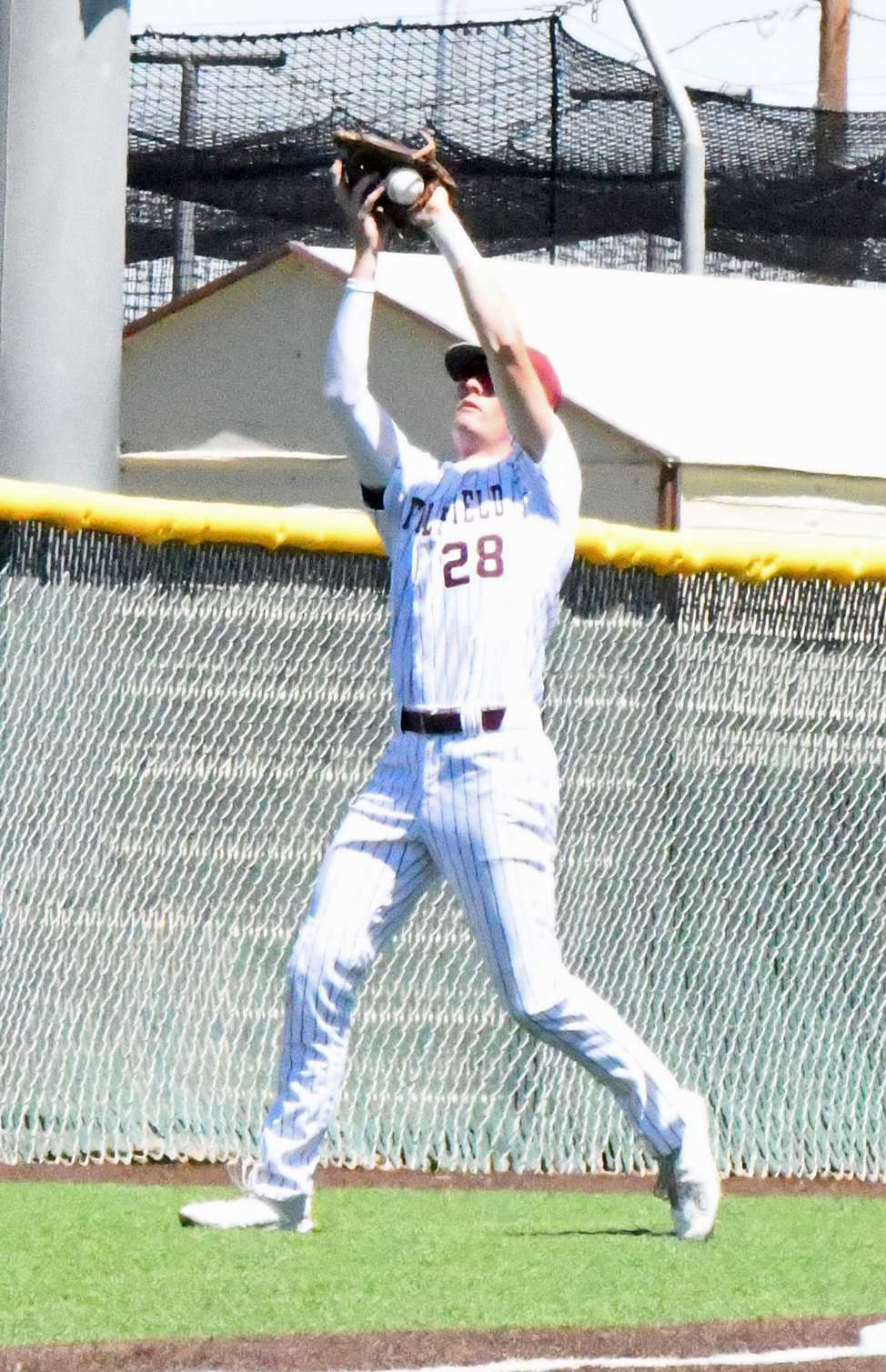 Littlefield junior, Chip Green, catchesa pop in foul territory at third base for the third out of the top of the first inning, during the Wildcats’ Game 2 loss to Shallowater in the 3A Regional Quarterfinal round of the play-offs. (Staff Photo by Derek Lopez)