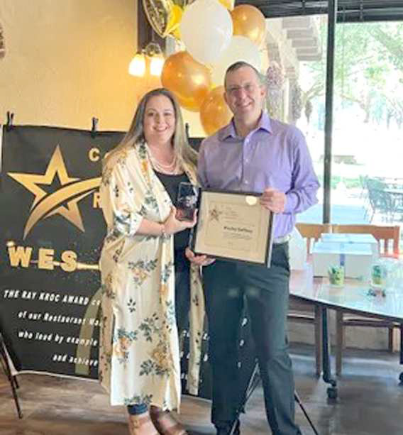 WES GAFFNEY accepts the Ray Kroc Award. Gaffney is the former manager of the Littlefield McDonald’s location. Courtesy of Evita Bandel