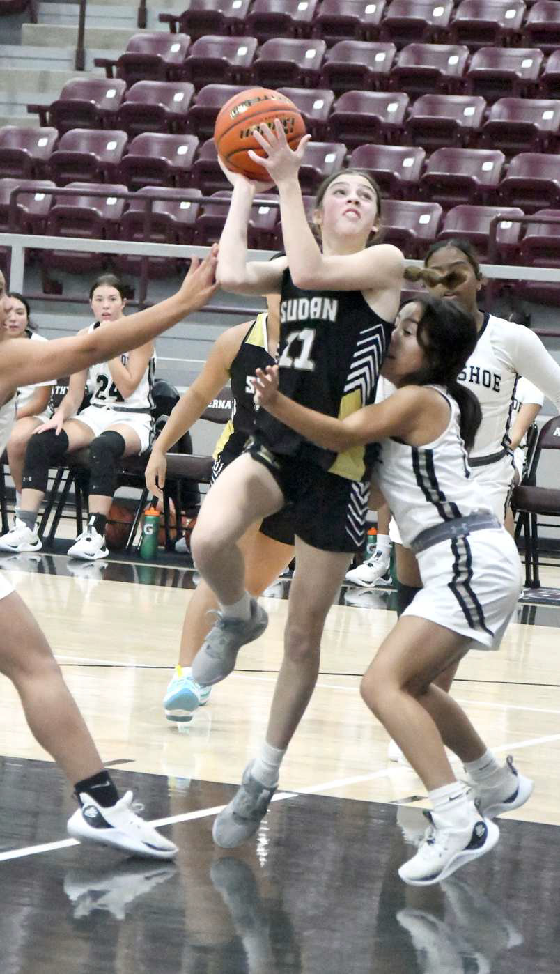 Sudan’s Addison Cornelius, goes up strong to the basket and draws a shooting foul, during the second quarter of the Nettes’ tournamentopener against Muleshoe on Thursday in Abernathy. (Staff Photo by Derek Lopez)