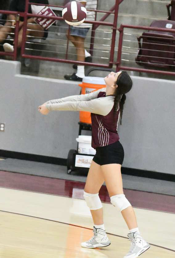KEEPING THE BALL IN PLAY - Littlefield’s Lady Cat, Madi Brown, bumps a ball up into the air, as the Lady Cats look to go on the attack, during their, 0-3 loss to Ropes at Wildcat Gym on Tuesday. (Staff Photo by Derek Lopez)
