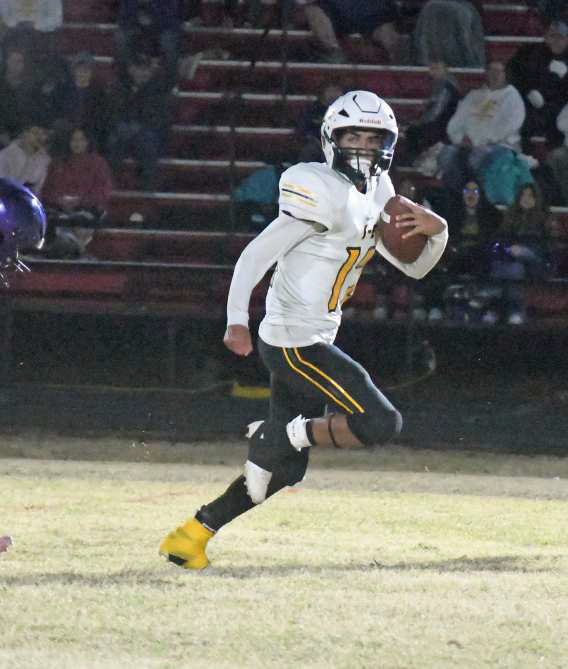 Springlake-Earth senior tailback, JJ Jaramillo, breaks loose on a 50-yard touchdown run, during the second quarter of the Wolverines’, 42-34, Area round loss to Miami on Friday at Motley County. (Staff Photo by Derek Lopez)