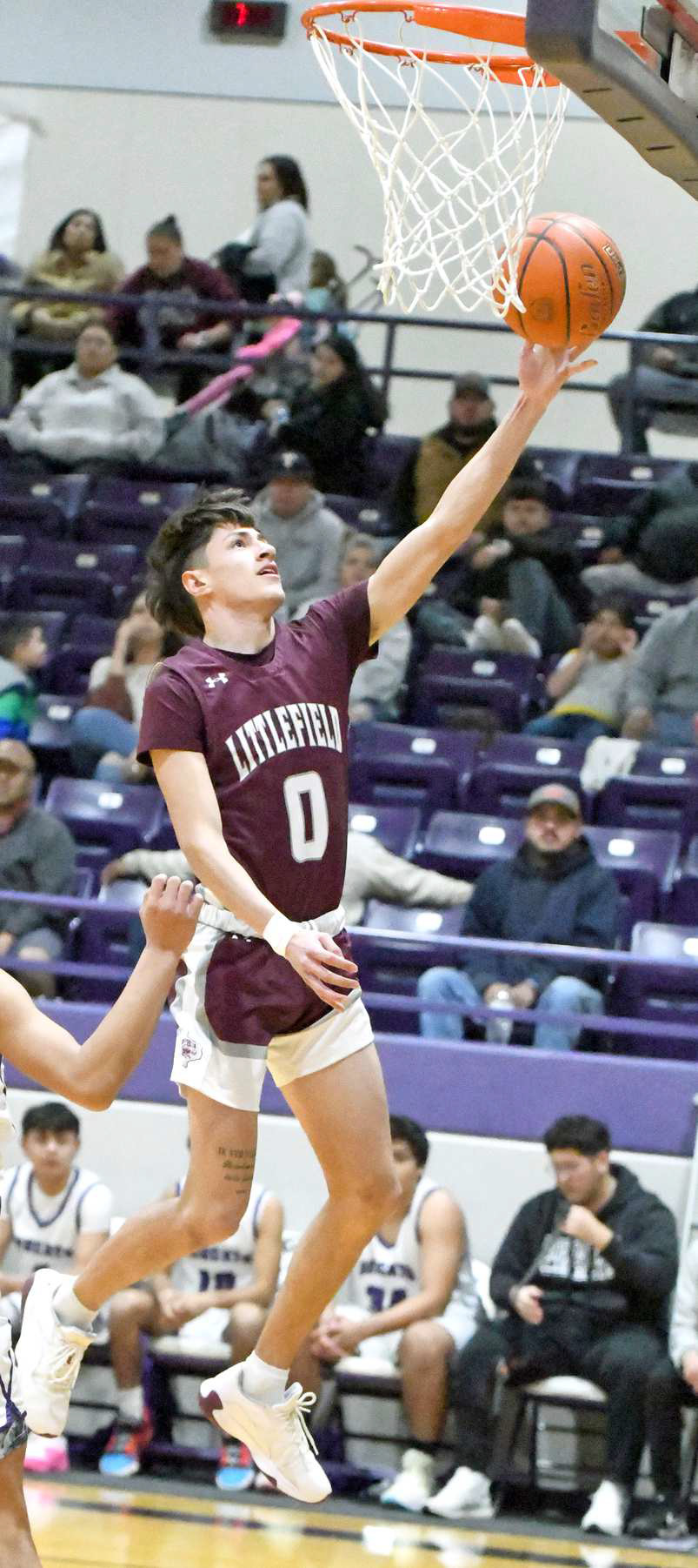 Littlefield senior guard, Omar Martinez (0), beats the defense for an easy lay-up, during the first half of the Wildcats’, 81-44, road victory over the Bobcats on Friday in Dimmitt. (Staff Photo by Derek Lopez)