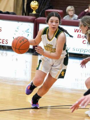 DRIVING TO THE BASKET- Springlake-Earth’s, Jasmine Garcia, puts the ball on the hardwood, as she looks to get into the paint for a high-percentage shot, during the first half of the Lady Wolverines’ bi-district contest with Wildorado on Tuesday. The Lady Wolverines came up short in the contest, as their season came to an end in Hereford. (Staff Photo by Derek Lopez)