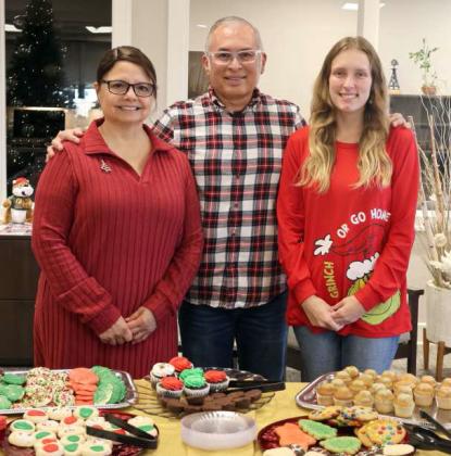 Elsa Rendon, Rene Nevarez, and Chasity Gray served up Christmas cheer during the Open House and First Bank &amp;amp; Trust on Hall Avenue in Littlefield on Friday December 20, 2024. (Photo by Ann Reagan)