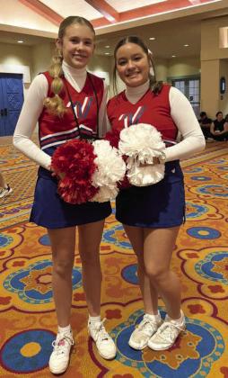 Emilee Synatschk (Olton JH) and Myla Mosqueda (SE JH) at All-American in Orlando Florida. They got to walk in the Thanksgiving Day parade down Main Street. (Submitted Photo)