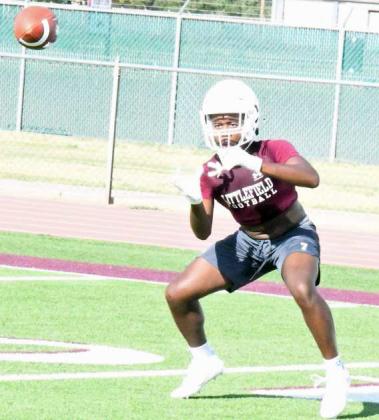 Littlefield’s Eizeah Coleman catches a ball and gets in and out of his route, during their first day of two-a-day practice at Wildcat Field on Monday. (Staff Photo by Derek Lopez)