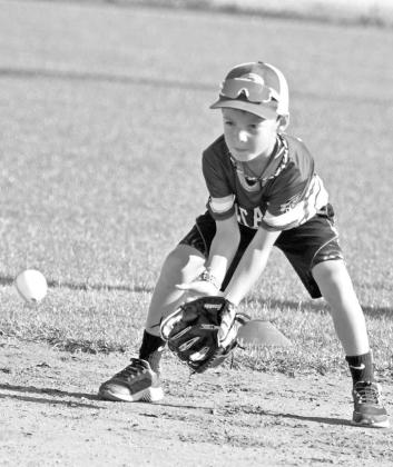 Campers at the first session of the Olton Youth Baseball Camp worked on being in a good pre-pitch position with New Olton Head Baseball Coach Kris Cavazos Wednesday morning at the Olton Youth Baseball Field. (Staff Photo by Derek Lopez)