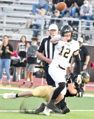 GETTING PRESSURE – Sudan sophomore, Drew Carr, gets his hands on the quarterback and forces an incomplete pass, during the first half of Sudan’s 46-14, Homecoming victory on Friday at Hornet Stadium. (Staff Photo by Derek Lopez)