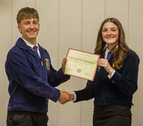 FFA Secretary Devyn Crouch presents Payton Bussanmus with a Chapter FFA Degree at the annual FFA banquet on May 12, 2025. (Staff Photo by Madison Vidales)