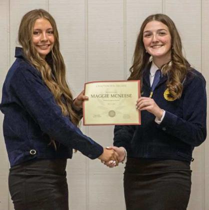 FFA Secretary Devyn Crouch presents Maggie McNeese with a Chapter FFA Degree at the annual FFA banquet on May 12, 2025. (Staff Photo by Madison Vidales)