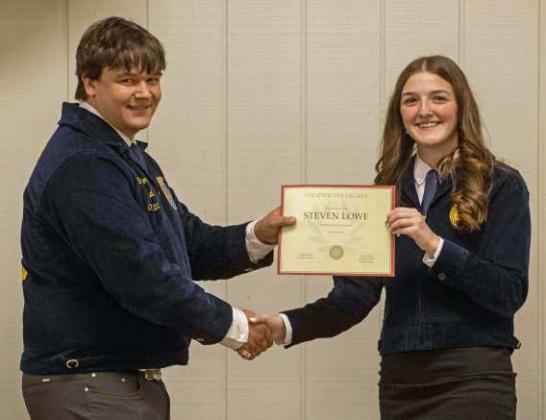 FFA Secretary Devyn Crouch presents Steven Lowe with a Chapter FFA Degree at the annual FFA banquet on May 12, 2025. (Staff Photo by Madison Vidales)