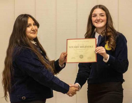 FFA Secretary Devyn Crouch presents Yovany Melendez with a Chapter FFA Degree at the annual FFA banquet on May 12, 2025. (Staff Photo by Madison Vidales)