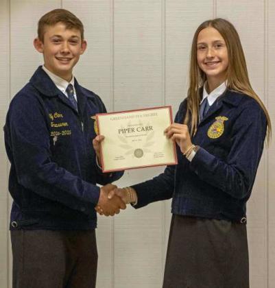 FFA Vice President Ty Carr presents Piper Carr with a Greenhand FFA Degree at the annual FFA banquet on May 12, 2025. (Staff Photo by Madison Vidales)