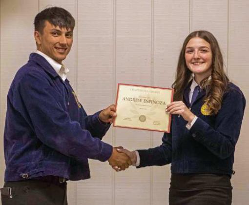 FFA Secretary Devyn Crouch presents Andrew Espinoza with a Chapter FFA Degree at the annual FFA banquet on May 12, 2025. (Staff Photo by Madison Vidales)
