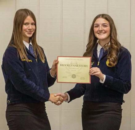 FFA Secretary Devyn Crouch presents Brooklynne Story with a Chapter FFA Degree at the annual FFA banquet on May 12, 2025. (Staff Photo by Madison Vidales)