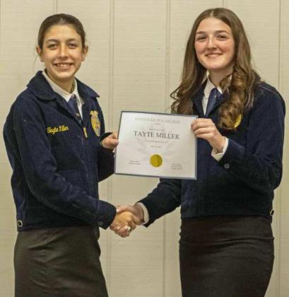 FFA Secretary Devyn Crouch presents Tayte Miller with a Chapter FFA Degree at the annual FFA banquet on May 12, 2025. (Staff Photo by Madison Vidales)