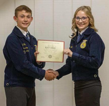 FFA Vice President Ty Carr presents Kat Hill with a Greenhand FFA Degree at the annual FFA banquet on May 12, 2025. (Staff Photo by Madison Vidales)
