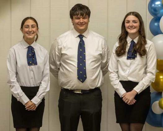 Retired FFA officers Teagan Miller, Steven Lowe and Devyn Crouch retire their FFA jackets at the annual FFA banquet on May 12, 2025. (Staff Photo by Madison Vidales)