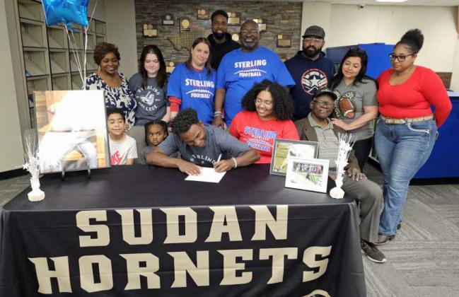 Sudan’s Marcello King signed his Letter of Intent on Monday to continue his football and academic career at Sterling College in Kansas, where King will be playing running back for the Warriors. King signed during a small ceremony in the Sudan High School Library on Monday, joined by family, friends and coaches. (Staff Photo by Derek Lopez)