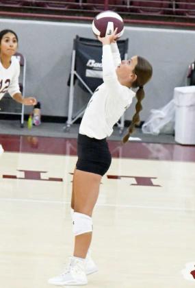 SETTING UP THE ATTACK - Littlefield setter, Bryndle Ray, sets a ball up in the air as the Lady Cats look to strike for a point, during their victory over the Lubbock Titans on Tuesday at Wildcat Gymnasium. (Staff Photo by Derek Lopez)