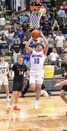 Olton senior, Allen Vasquez ties the game, 45-45, with 1:18 to play in the final quarter of the Mustang’s 2A-DI Regional Semi-Final game against Reagan County in Lamesa on Tuesday. (Staff Photo by Derek Lopez)