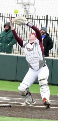 Senior catcher, Taryn Golden, catches a popped up bunt, during the top of the first inning of the Lady Cats’, 17-3, victory in their seasonopener on Saturday over LCHS. (Staff Photo by Derek Lopez)