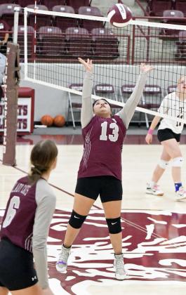 Littlefield JV1’s setter sets a ball up in the air, as the Lady Cats look to go on the offensive, during the first set of their 1-2 loss to Tulia on Tuesday at Wildcat Gym. (Staff Photo by Derek Lopez)