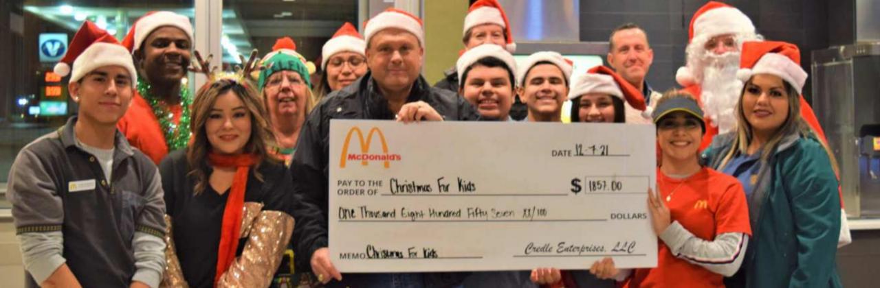 FUND RAISER EVENT--The Sheriff’s Department elves along with McDonald’s and Santa Claus raised $1,857.00 for “Christmas for Kids” this year. The McDonald’s pie sales event took place on Tuesday evening, Dec. 14th. (Photo by Ann Reagan)