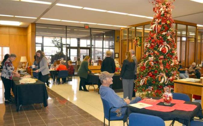 CHRISTMAS OPEN HOUSE--Wellington State Bank was the place to be at noon on Wednesday, Dec. 8th during their annual Open House. Lots of good food was served by the staff and all the folks attending had a good time visiting. (Photo by Grata Reber)