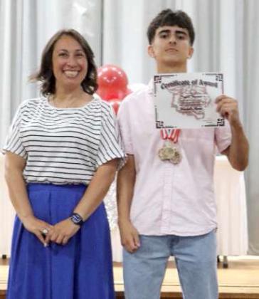 The Littlefield Jr. High Principal’s Award was awarded to Jacob Fuentes during the Jr. High Awards Ceremony in May. Ms. Acevedo, Principal, is shown on the left. (Submitted Photo)