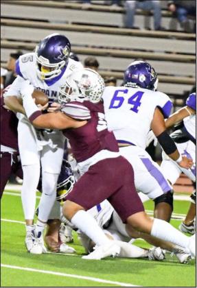 Littlefield senior defensive tackle, Marcquis Rosemond (50), sacks Crane quarterback, Tyson Brents (5), during the first quarter of the Wildcats’ Class 3A Area Championship win over Crane on Friday in Lamesa. (Staff Photo by Derek Lopez)