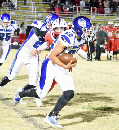 Amherst junior, Kevin Garcia takes a run around the right side for the Bulldogs, during their Bi-district clash with Silverton on Friday in Petersburg. (Staff Photo by Derek Lopez)