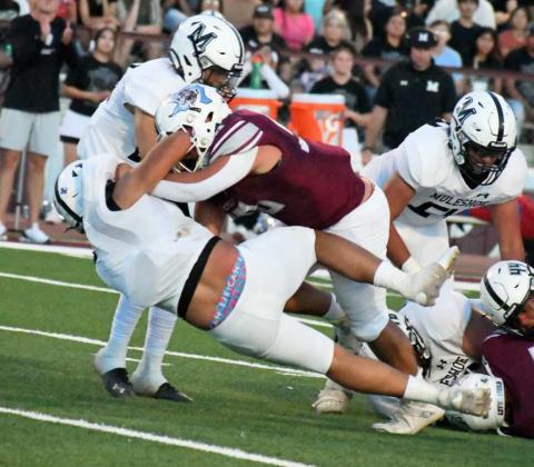 GET THE SYRUP - Littlefield sophomore offensive tackle, Marcquis Rosemond, delivered a pancake block on a Muleshoe defender, during the Wildcats’, 28-7, victory over the Muleshoe Mules on Friday night in their home-opener at Wildcat Stadium. (Staff Photo by Derek Lopez)