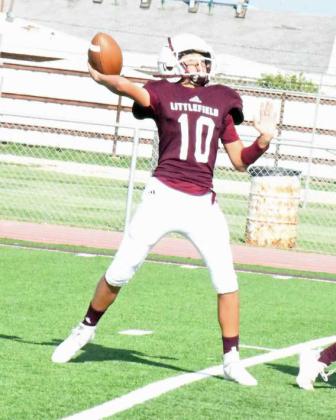 FINDING THE OPEN MAN – Littlefield JV quarterback, Nate Castaneda, drops back and fires a pass down the near sideline looking for an open receiver, during their, 36-18, victory over Post at Wildcat Stadium on Thursday. (Staff Photo by Derek Lopez)