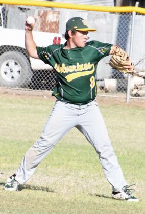GETTING THE OUT - Springlake-Earth second baseman, Braden Bradley, fields up a ground ball and throws it to first for an out, during the Wolverines’, 17-7, run-rule victory over the Petersburg Buffaloes on Monday in Earth. (Staff Photo by Derek Lopez)