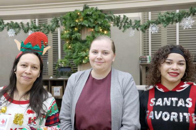 Lamb County Librarian, Selena Sanchez, Part-Time librarian, Samantha Tucheck, and Assistant Librarian Ambrosia Simpson hosted the Lamb County Library Open House and Gingerbread House contest sponsored by the Lamb County Library Board on Friday, December 15, 2023. (Photo by Ann Reagan)