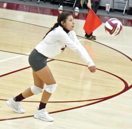 BREAKING THE SERVE – Littlefield junior Libero, Emily Champion, breaks the serve from Tulia, during the Lady Cats’ match with the Lady Hornets on Tuesday at Wildcat Gym. (Staff Photo by Derek Lopez)