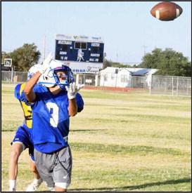 An Olton JV Receiver works towards the sideline for a ball, during the Mustang’s intersquad scrimmage on Saturday. (Staff Photo by Derek Lopez)