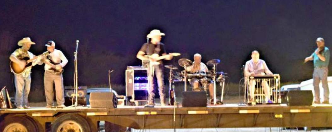 THE GUYLE ROBERSON BAND headlined the annual Tailgate Pary featuring Left to right Mike Hill of Amherst on bass, Mike Richey of Springlake on bass, Guyle Roberson on guitar and lead singer, David Newton on drums, Baxter Vaughn on keyboard and steele, and Mark Brown on fiddle.