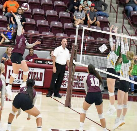 DELIVERING THE KILL – Littlefield’s Ashtyn Parker, sends a kill through the block attempt of the Idalou players, during the Lady Cat’s loss to Idalou on Monday at Wildcat Gym in Littlefield. (Staff Photo by Derek Lopez)