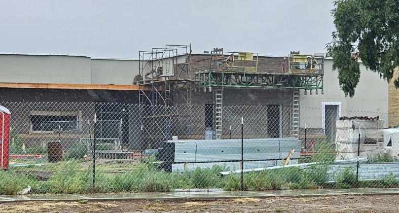 Construction continues on the new Littlefield Junior High School building, as crews compete with the weather, as they try to finish bricking the front of the new addition to the building that connects the main building to the old gym. (Staff Photo by Derek Lopez)