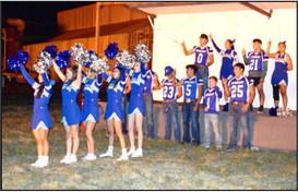 Bulldogs forever! The Amherst Football team and cheerleaders lead the school song during the Homecoming Bonfire held at the Amherst Gin Yard on Thursday, September 21, 2023. (Photo by Ann Reagan)
